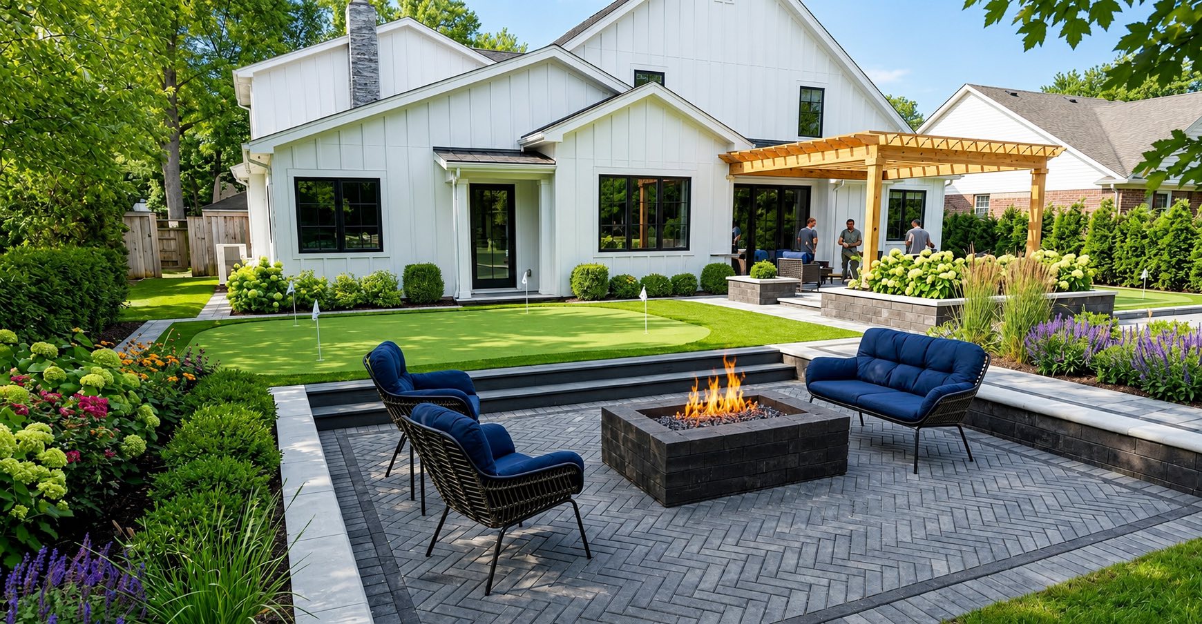 Polaris Landscape backyard project: putting green, herringbone paver patio, fire pit, and pergola